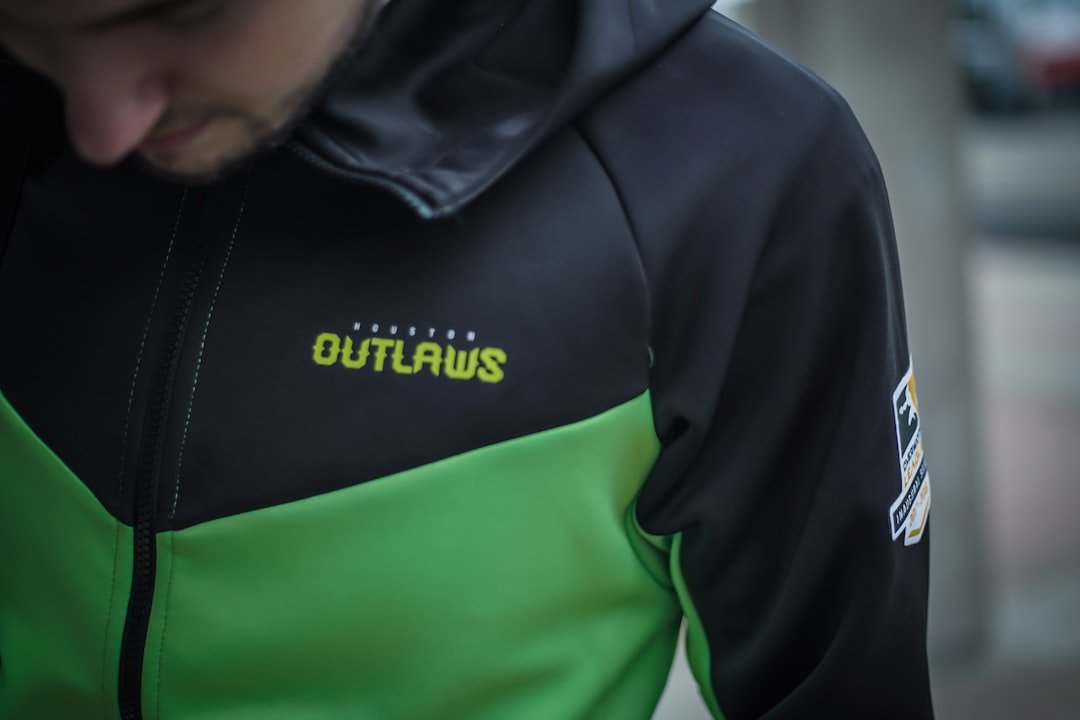 Esports fan walks by in front of Overwatch gaming arena.